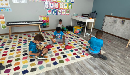 Cute toddlers playing in the classroom